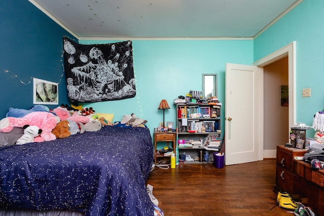 bedroom with crown molding and wood-type flooring