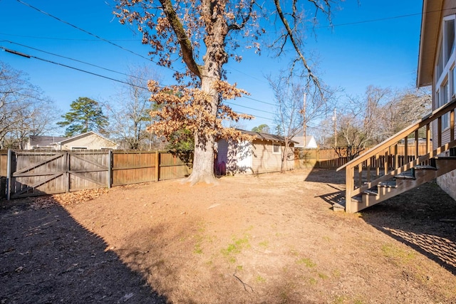 view of yard featuring a storage unit