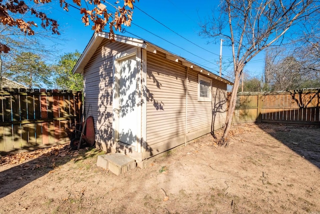 view of property exterior featuring a storage unit