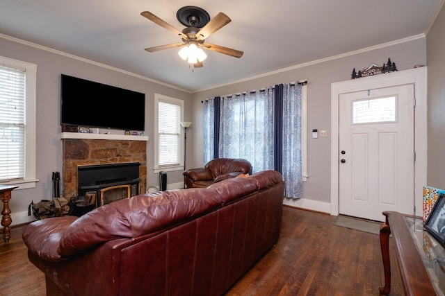 living room with crown molding, dark hardwood / wood-style floors, and ceiling fan