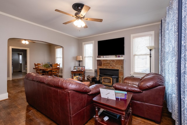 living room with ceiling fan, ornamental molding, and dark hardwood / wood-style floors