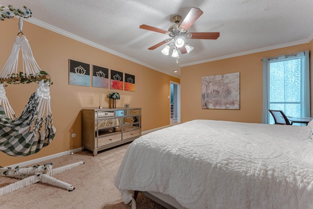 bedroom featuring crown molding, carpet, a textured ceiling, and ceiling fan