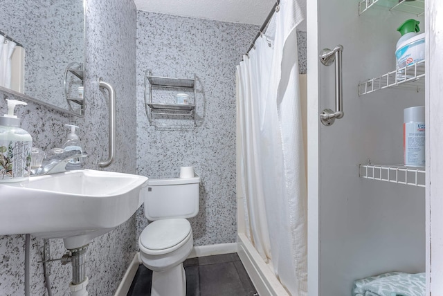 bathroom featuring toilet, tile patterned floors, and a shower with curtain