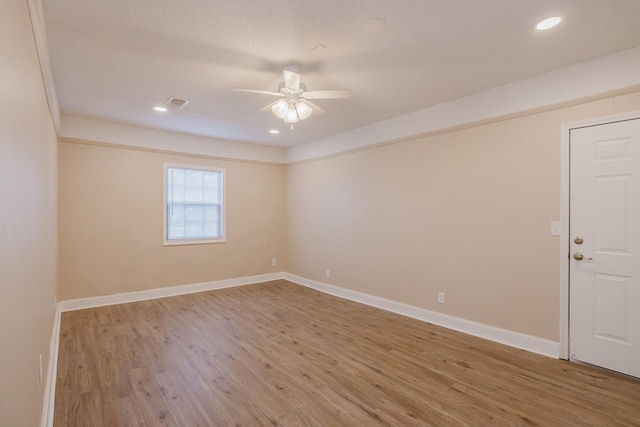 empty room featuring ceiling fan and wood-type flooring