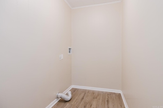 laundry room with washer hookup, ornamental molding, and light wood-type flooring