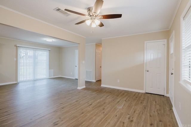 spare room featuring crown molding, ceiling fan, and light hardwood / wood-style flooring