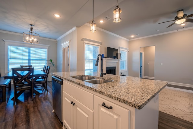 kitchen featuring sink, white cabinetry, stainless steel dishwasher, dark hardwood / wood-style flooring, and a kitchen island with sink