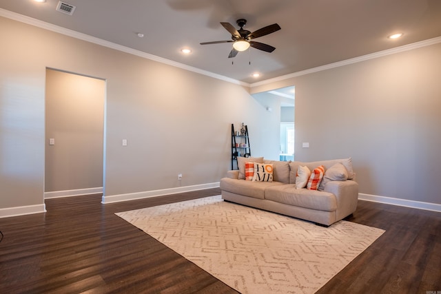 living room with crown molding, dark hardwood / wood-style floors, and ceiling fan