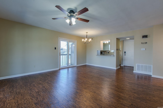 unfurnished living room with dark hardwood / wood-style flooring and ceiling fan with notable chandelier