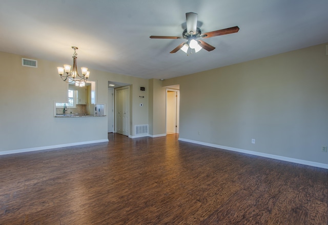 unfurnished living room featuring dark hardwood / wood-style flooring, sink, and ceiling fan with notable chandelier