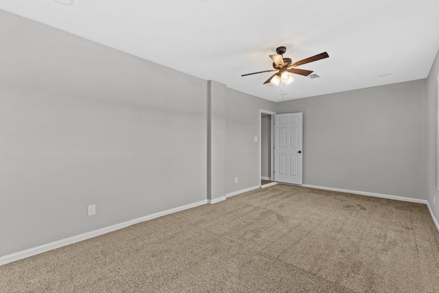 empty room featuring carpet flooring and ceiling fan