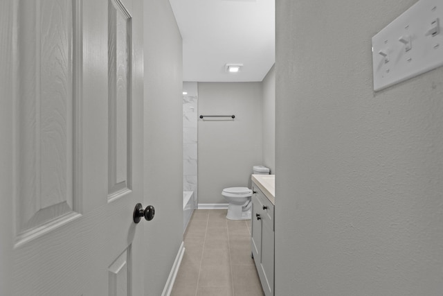 bathroom featuring vanity, tile patterned flooring, and toilet