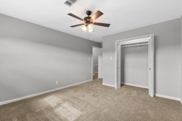 unfurnished bedroom with carpet, ceiling fan, and a closet