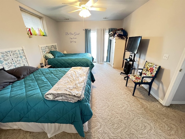 bedroom with ceiling fan and carpet