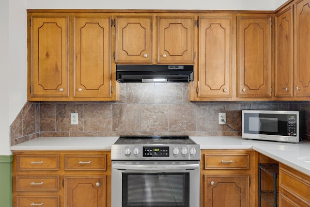 kitchen featuring appliances with stainless steel finishes and backsplash