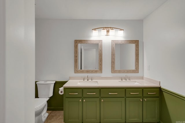 bathroom with vanity, tile patterned floors, and toilet