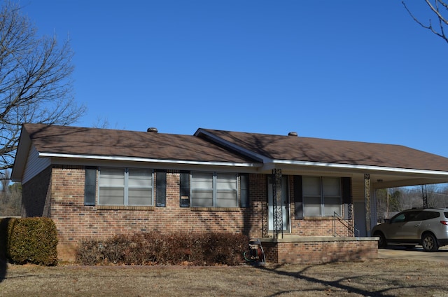 view of front of property with a carport