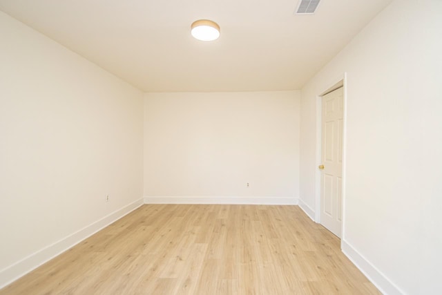 spare room with light hardwood / wood-style flooring