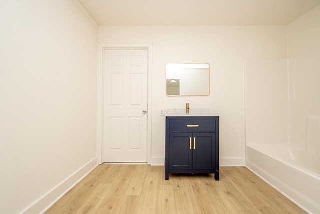 bathroom featuring vanity and hardwood / wood-style flooring