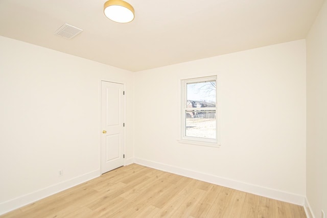 empty room with light hardwood / wood-style floors