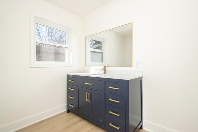 bathroom featuring vanity and hardwood / wood-style floors