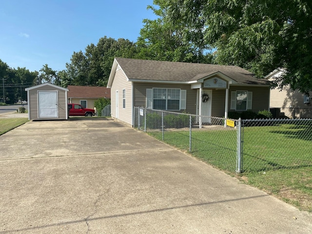 view of front of house featuring a front yard and a shed