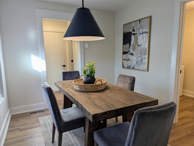 dining area with light wood-type flooring