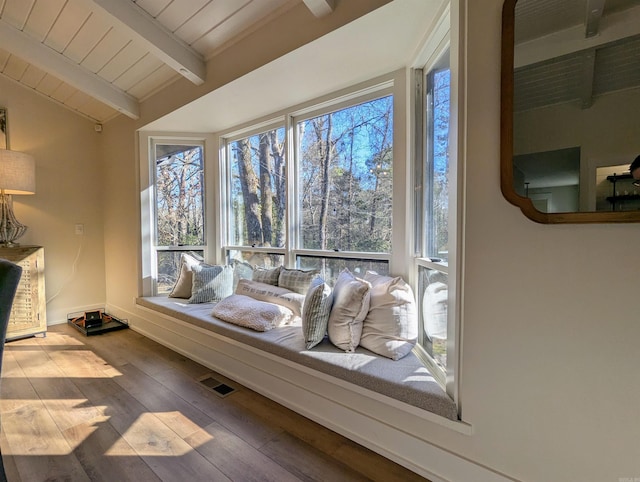 living area with lofted ceiling with beams, wood ceiling, and hardwood / wood-style floors