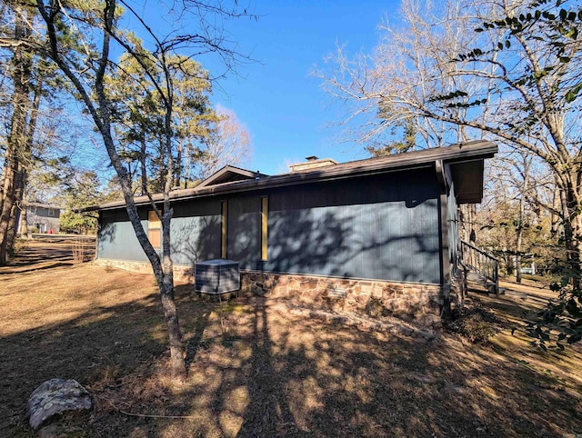 view of front of home featuring cooling unit