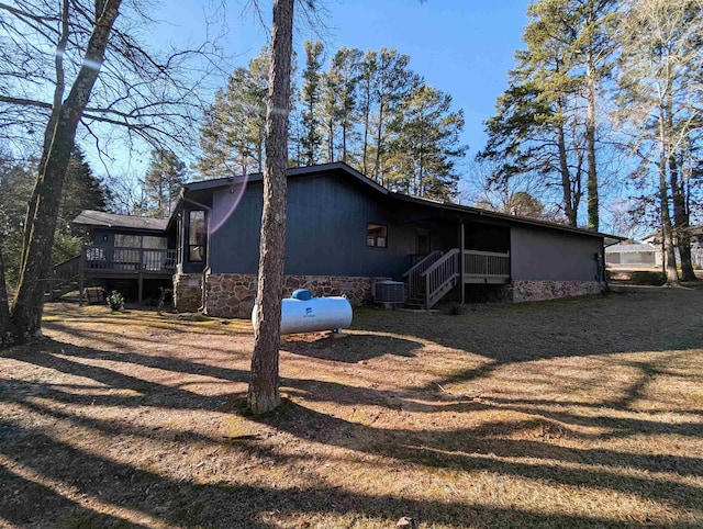 exterior space with a wooden deck and a yard