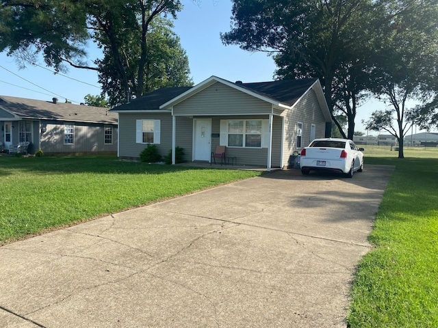 single story home featuring a front yard