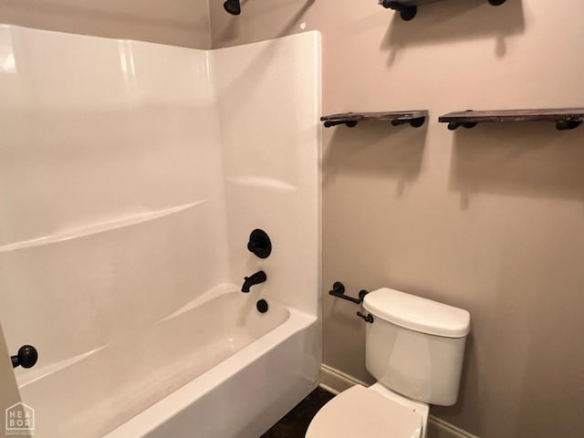 bathroom featuring  shower combination and toilet