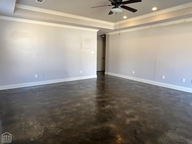 unfurnished room with ornamental molding, ceiling fan, and a tray ceiling