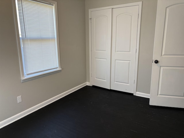 unfurnished bedroom featuring a closet