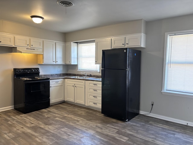 kitchen with white cabinetry, dark hardwood / wood-style floors, sink, and black appliances