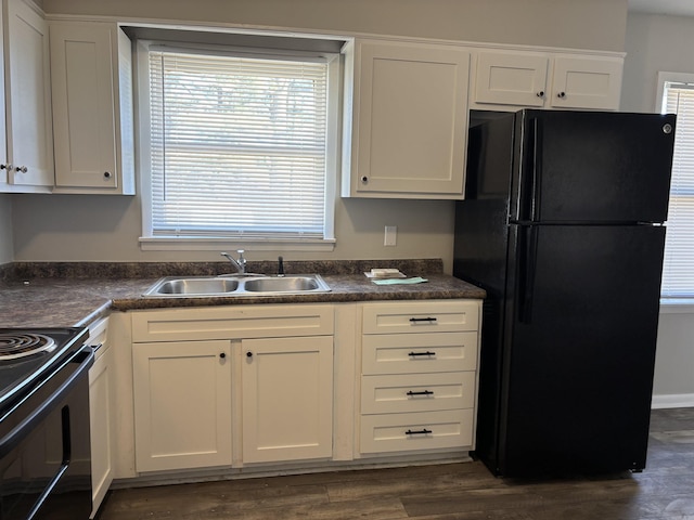 kitchen featuring white cabinetry, dark hardwood / wood-style floors, sink, and black appliances