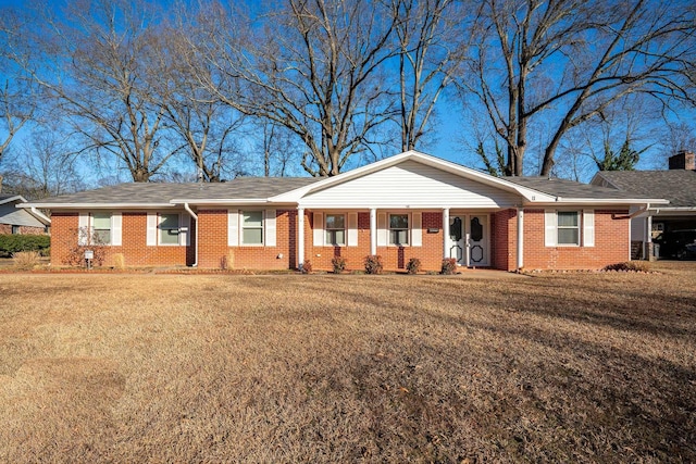 ranch-style home with a front lawn