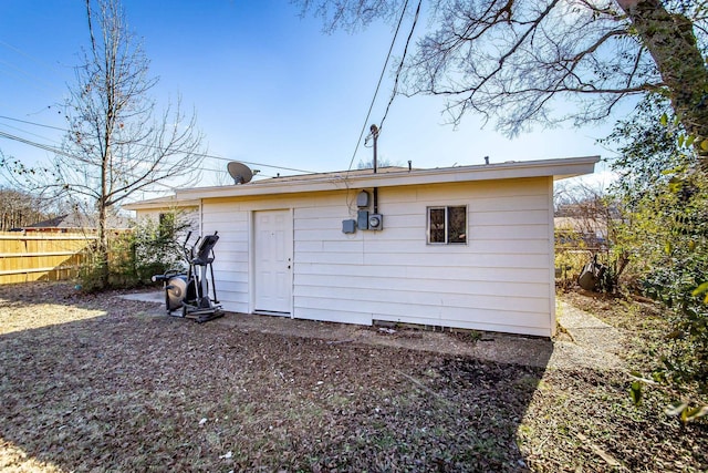 back of property with an outdoor structure