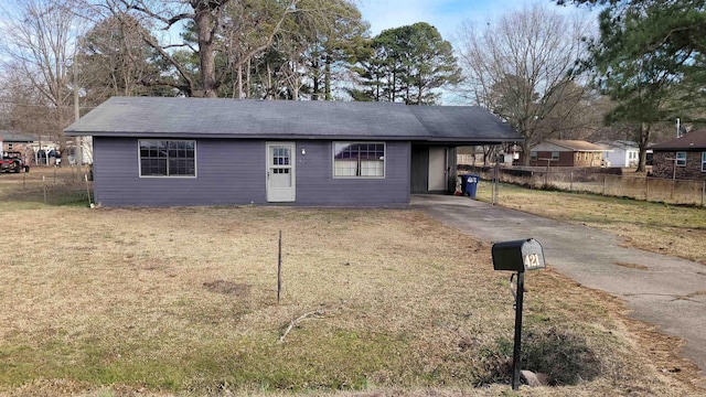 ranch-style house with a front lawn and a carport