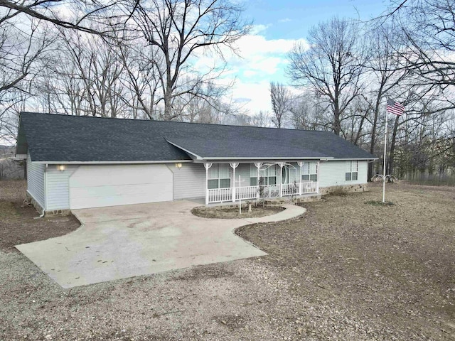 ranch-style home with a porch and a garage