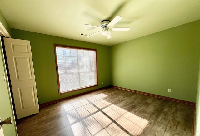 unfurnished room featuring hardwood / wood-style flooring and ceiling fan