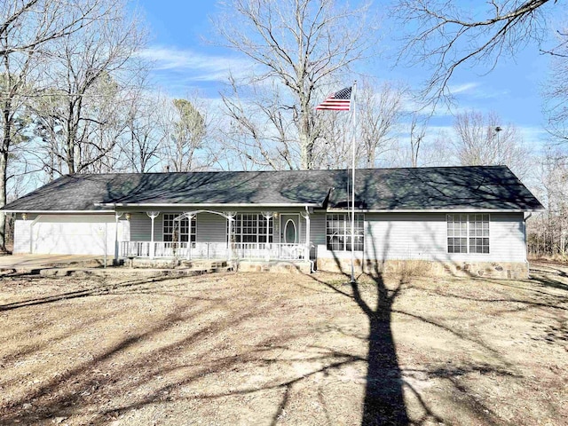 ranch-style house featuring a garage and a porch