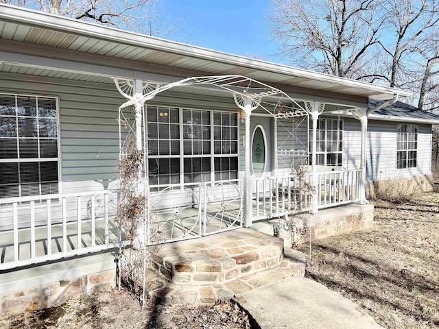 property entrance featuring covered porch