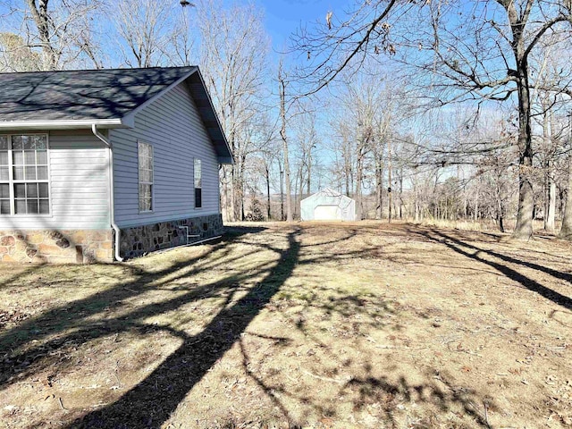 view of home's exterior with a garage and a yard