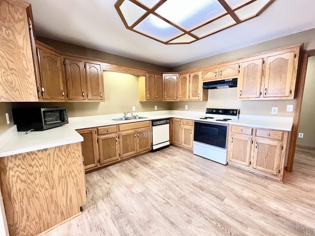 kitchen featuring sink, white appliances, and light hardwood / wood-style flooring