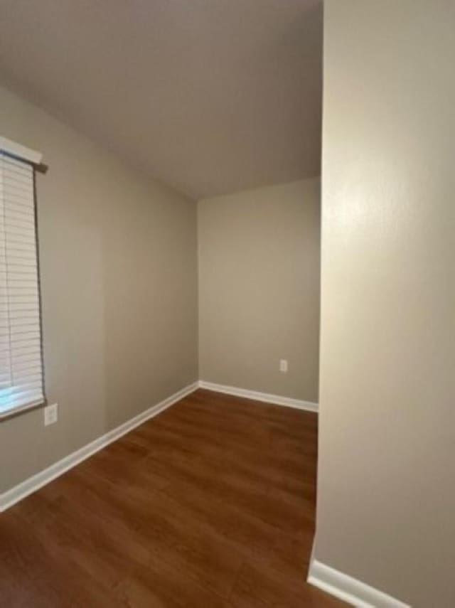 unfurnished room featuring wood-type flooring