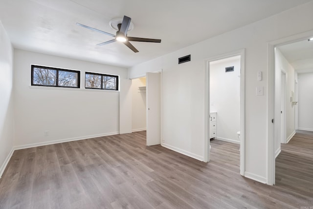 spare room featuring light hardwood / wood-style floors and ceiling fan