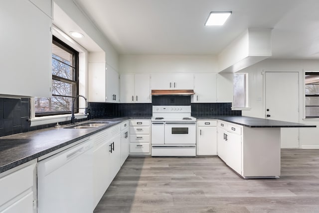 kitchen with white cabinetry, sink, white appliances, and light hardwood / wood-style flooring