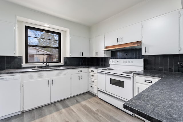 kitchen featuring white cabinetry, white appliances, sink, and decorative backsplash