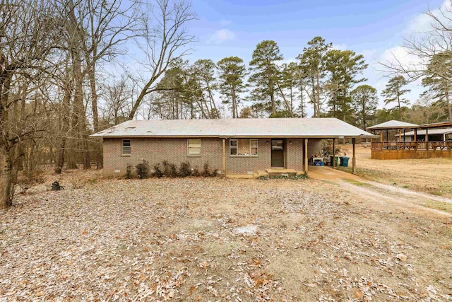 ranch-style home with a carport